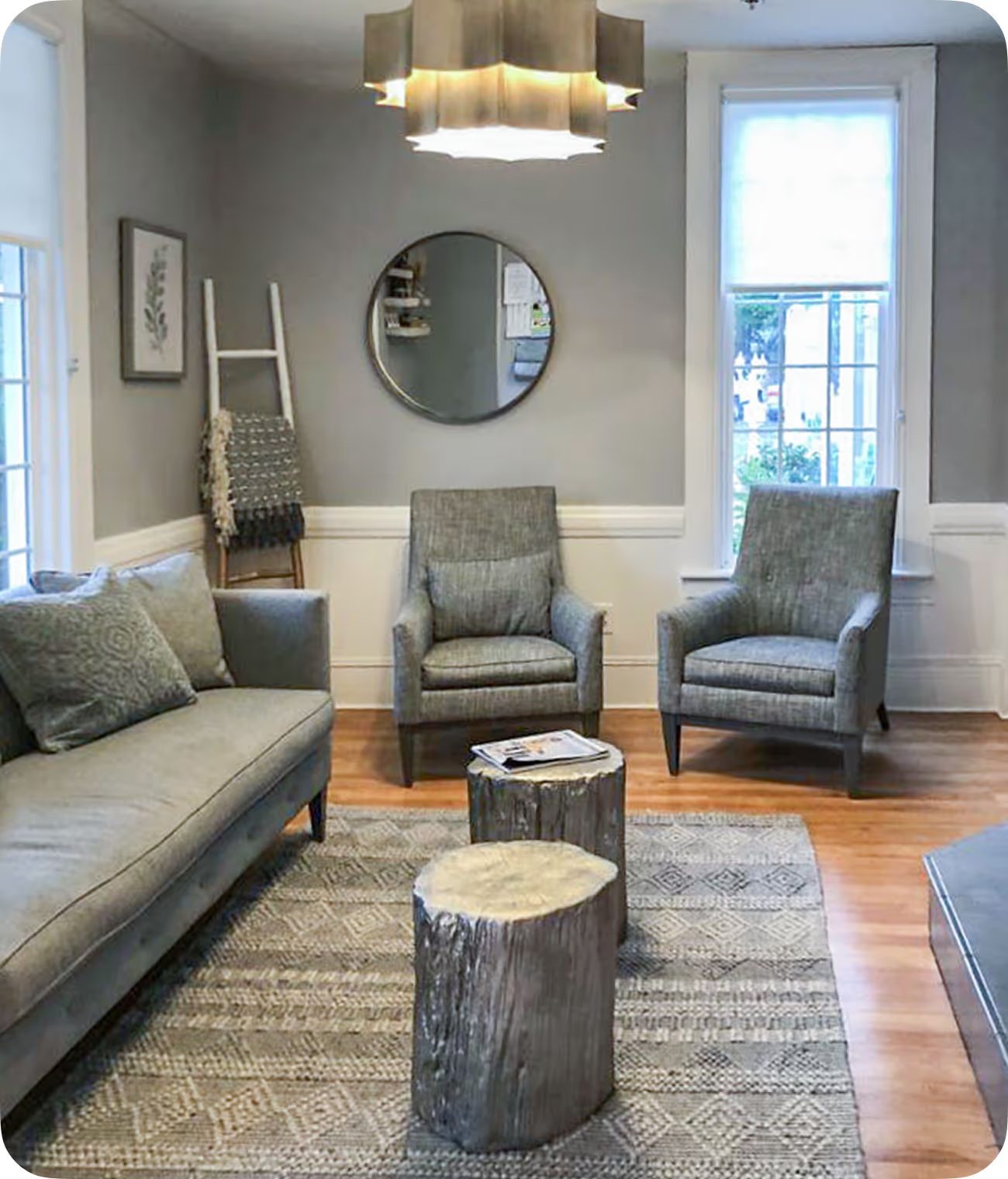 A quiet lounge with armchairs and a soft rug